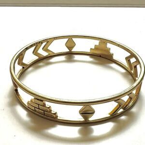 Gold tone cut out bangle bracelet